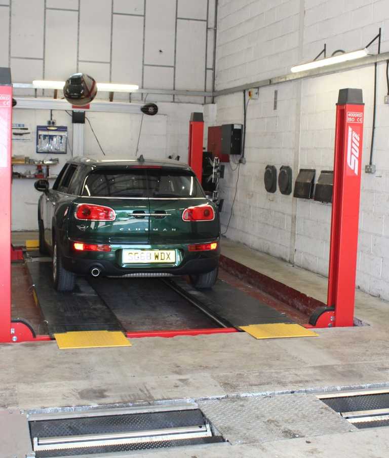 Car in the garage ready to be worked on